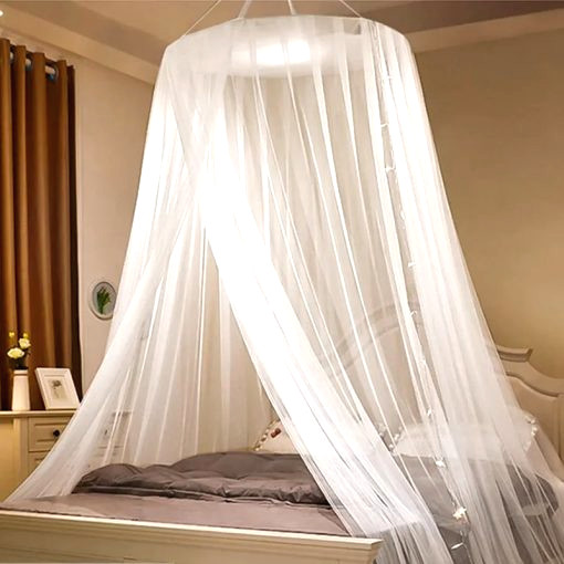 white mosquito net bed